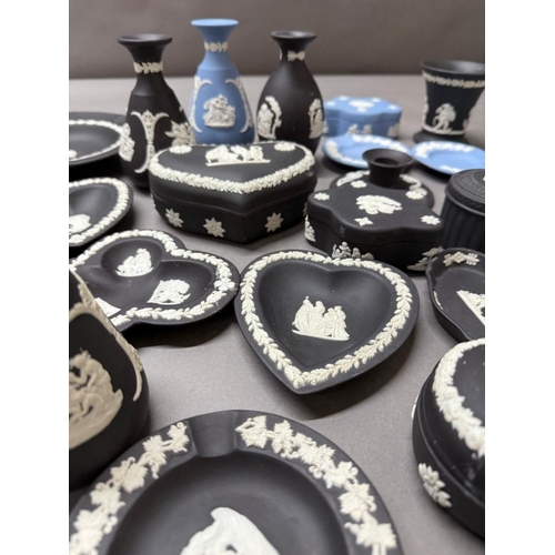264 - A quantity of Wedgewood Jasperware in black and white and blue and white to include pin dishes and v... 
