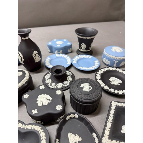 264 - A quantity of Wedgewood Jasperware in black and white and blue and white to include pin dishes and v... 