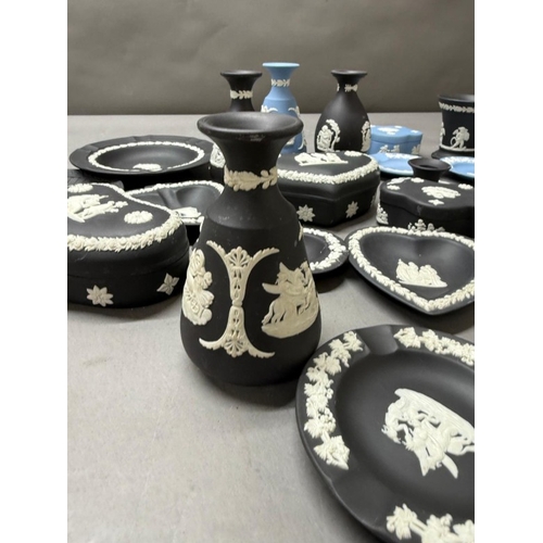 264 - A quantity of Wedgewood Jasperware in black and white and blue and white to include pin dishes and v... 