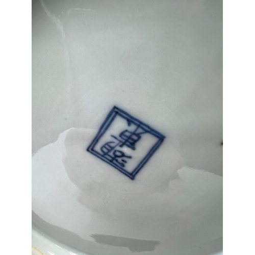 270 - A Japanese blue and white double gourd vase featuring a continuous landscaped scene, signed to base ... 