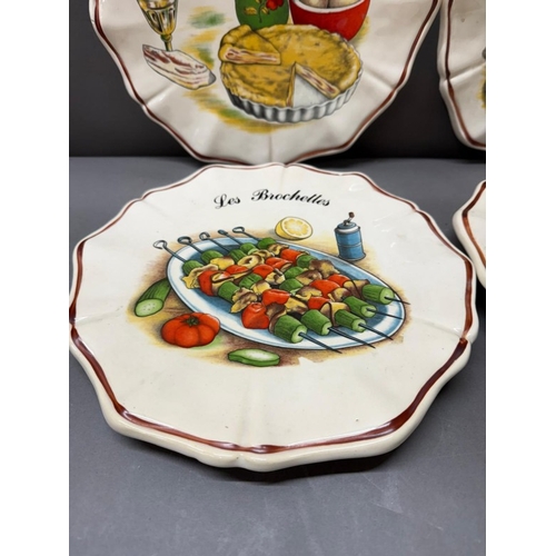 273 - Four Limador decorative plates featuring various dishes