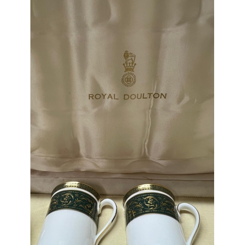 280 - A cased Royal Doulton coffee set for six Vanborough pattern.