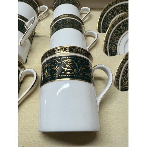 280 - A cased Royal Doulton coffee set for six Vanborough pattern.