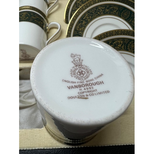 280 - A cased Royal Doulton coffee set for six Vanborough pattern.