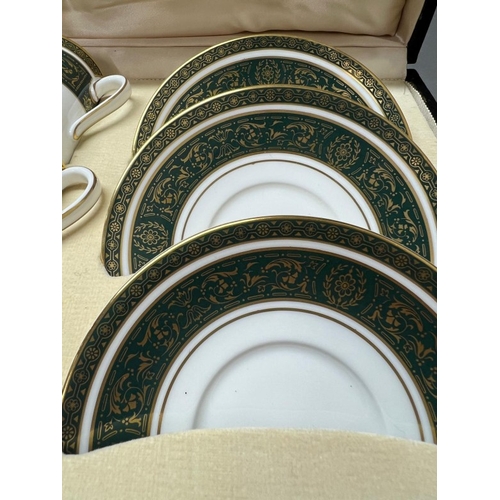 280 - A cased Royal Doulton coffee set for six Vanborough pattern.