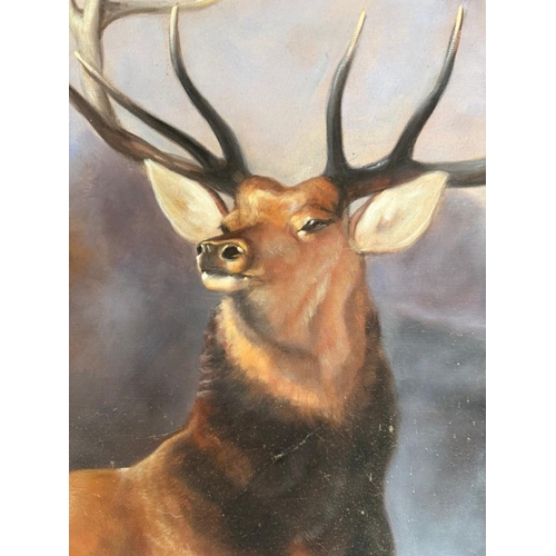 369 - A printed impressive contemporary picture of a stag, black ebonised frame. 94cm sq.