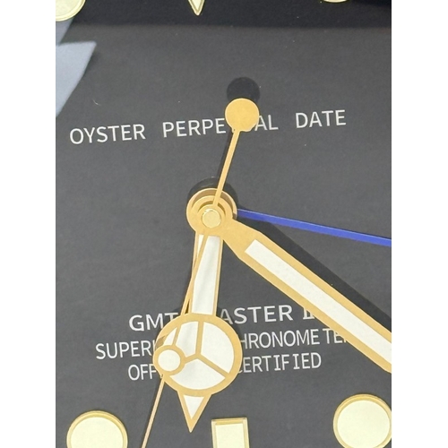 375 - A Rolex-style dealer display metal wall clock with sweeping motion  Dia34cm