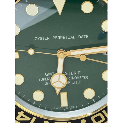 376 - A Rolex-style dealer display metal wall clock with sweeping motion  Dia34cm