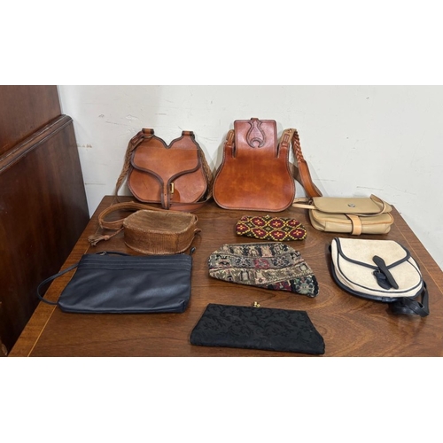 386 - A selection of various different hand bags to include two leather shoulder bags with a classic sligh... 