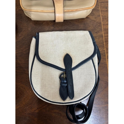 386 - A selection of various different hand bags to include two leather shoulder bags with a classic sligh... 