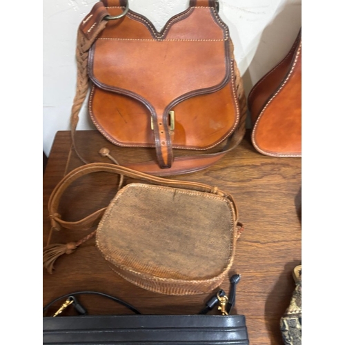 386 - A selection of various different hand bags to include two leather shoulder bags with a classic sligh... 