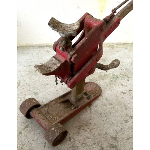 398 - A vintage red car jack