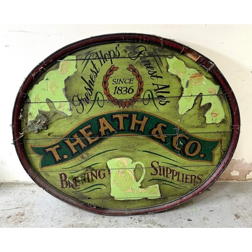 399 - An oval wooden advertising sign for T.Heath and Co brewing suppliers 91cm x 77cm