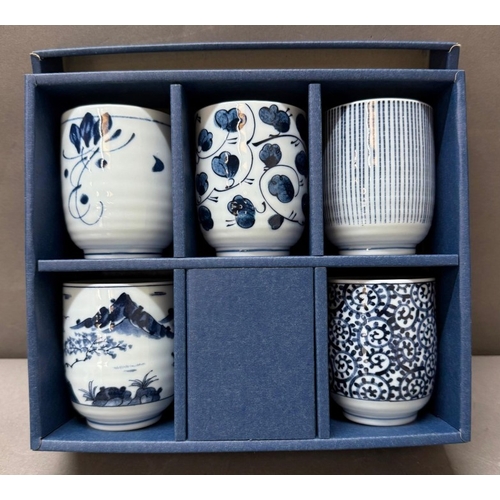 123 - A boxed set of blue and white tea cups