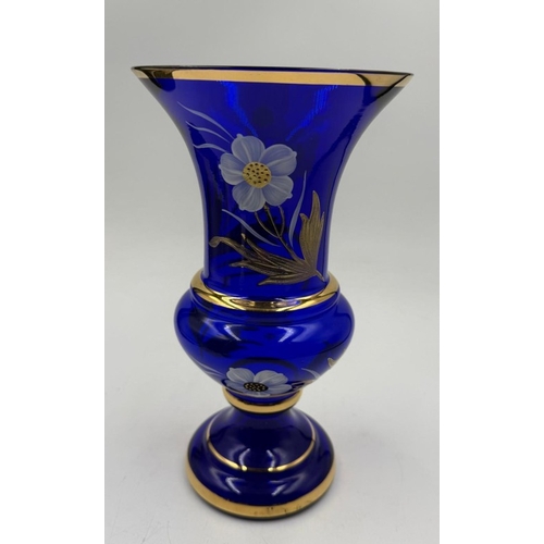 128 - A cobalt blue vase with gilt and floral detail