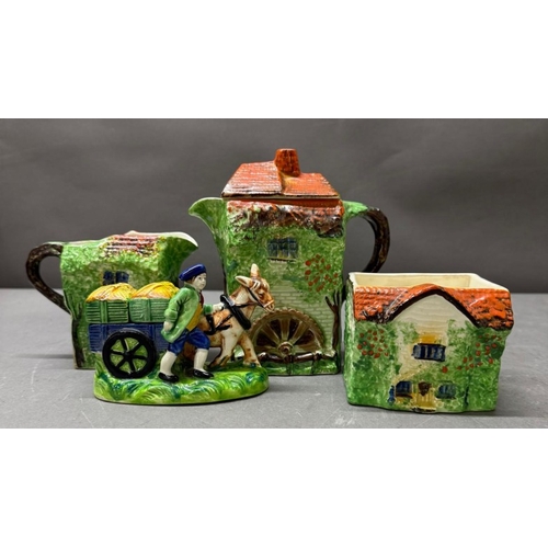 157 - A Ye Olde Cottage jug together with a horse and cart salt and pepper