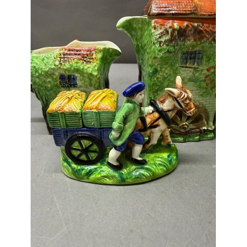 157 - A Ye Olde Cottage jug together with a horse and cart salt and pepper