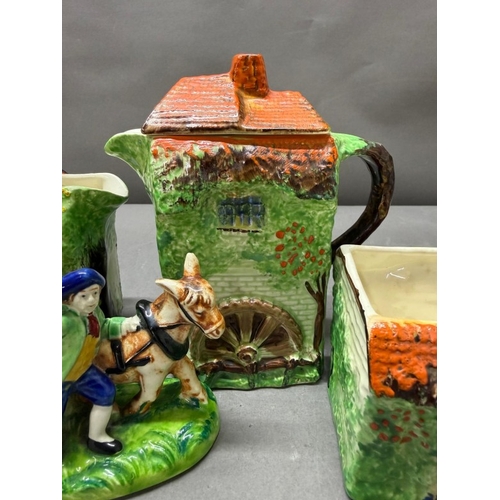 157 - A Ye Olde Cottage jug together with a horse and cart salt and pepper