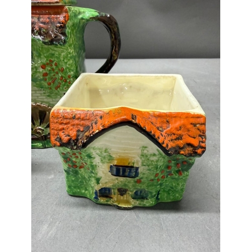 157 - A Ye Olde Cottage jug together with a horse and cart salt and pepper