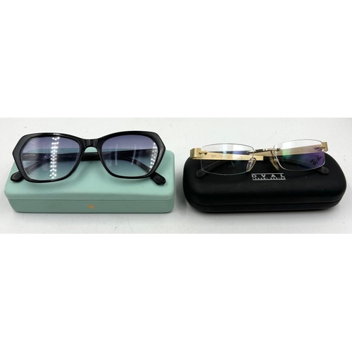 16 - A pair of Ray Ban rimless glasses and a pair of Tom Archer sunglasses