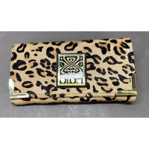 168 - A faux leopard skin purse by Biba or London