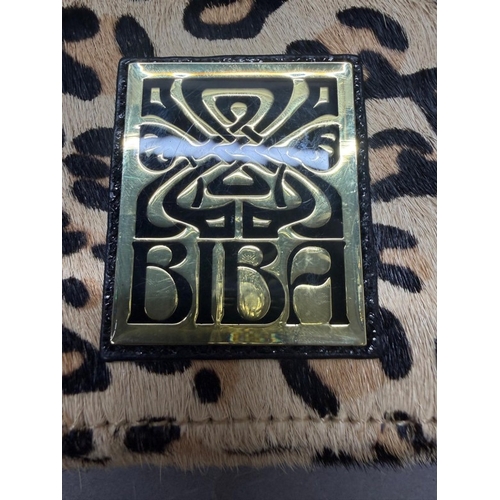 168 - A faux leopard skin purse by Biba or London