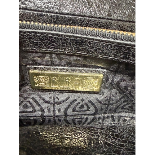 168 - A faux leopard skin purse by Biba or London