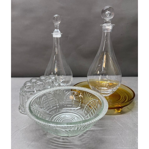 172 - A selection of glassware to include two Distington crystal decanters, a jelly mould and yellow foote... 