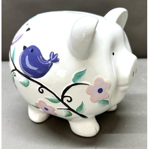 27 - A very large piggy bank with floral decoartion
