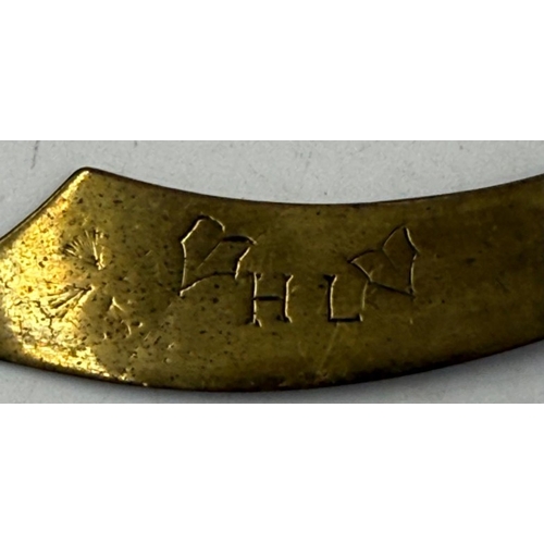 37 - A Trench Art letter opener along with an Army Ordnance Cap Badge.