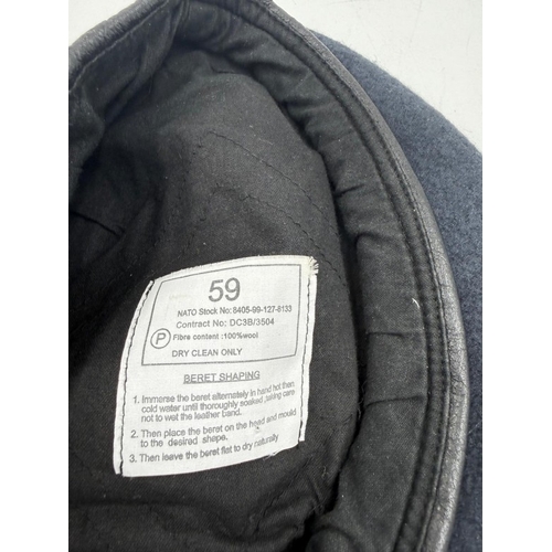52 - A blue RAF cap with a central badge