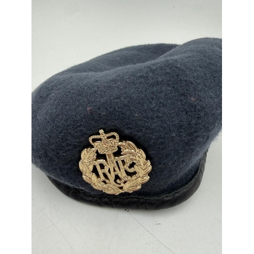 52 - A blue RAF cap with a central badge