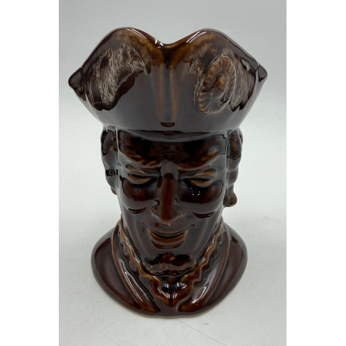 54 - A vintage brown ground glazed toby jug