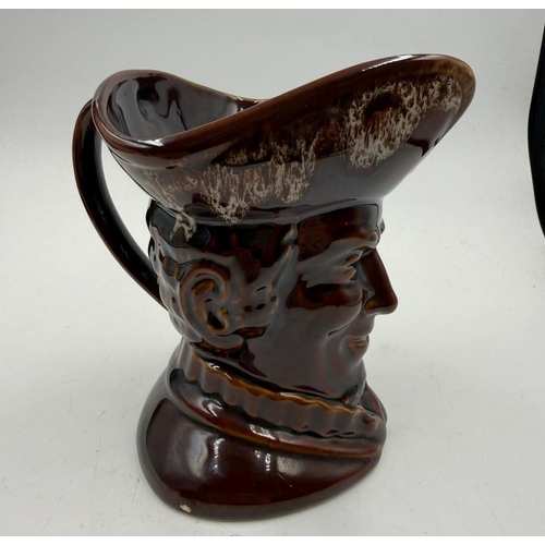 54 - A vintage brown ground glazed toby jug