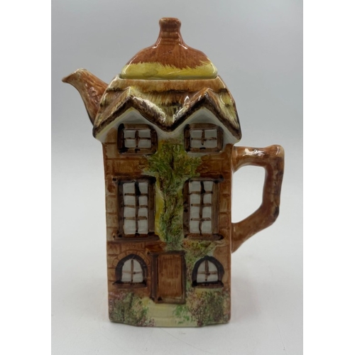 55 - A Price Kensington cottage ware teapot of a town house