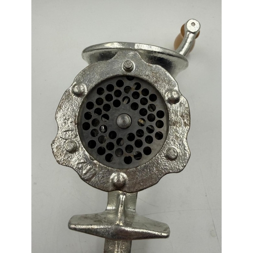 57 - A vintage cast iron meat grinder