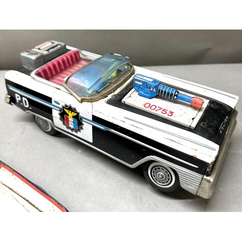 7 - Two AF Japanese tinplate cars, Police patrol and Highway patrol