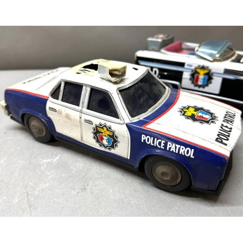7 - Two AF Japanese tinplate cars, Police patrol and Highway patrol