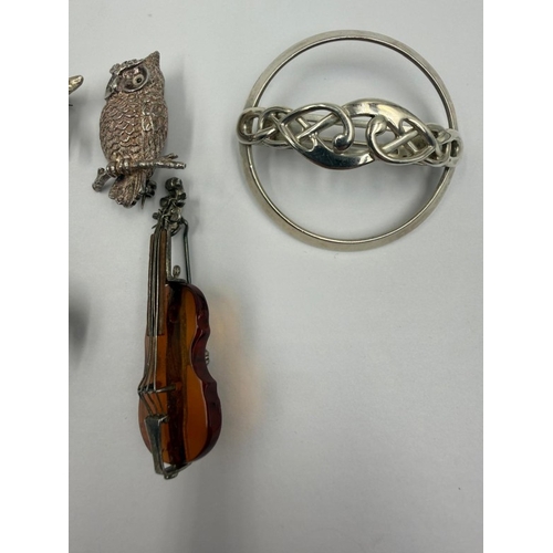 100 - Six silver stamped brooches (violin dog turtle owl and beautiful keltic design) plus a bug/fly brooc... 