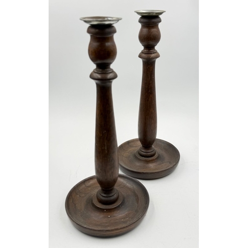 101 - A pair of wooden candlesticks