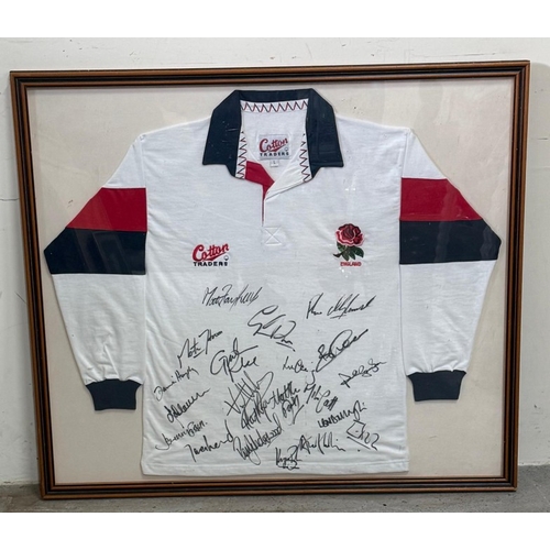 104 - A framed England rugby shirt signed by members of the England rugby team including Martin Johnson an... 
