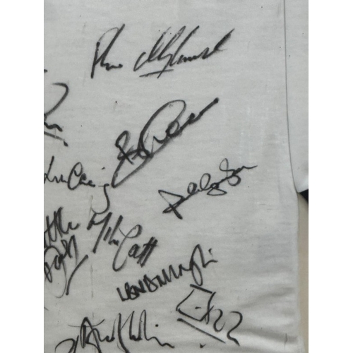 104 - A framed England rugby shirt signed by members of the England rugby team including Martin Johnson an... 