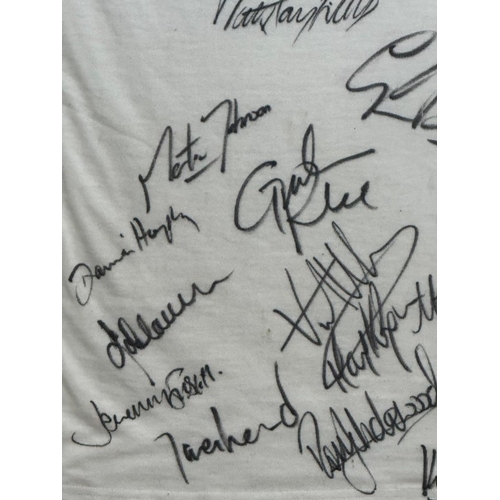 104 - A framed England rugby shirt signed by members of the England rugby team including Martin Johnson an... 