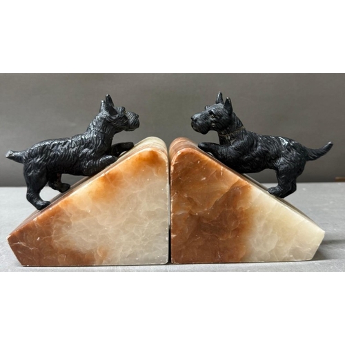 106 - Pair of Art Deco bookends with spelter dogs on alabaster bases.
