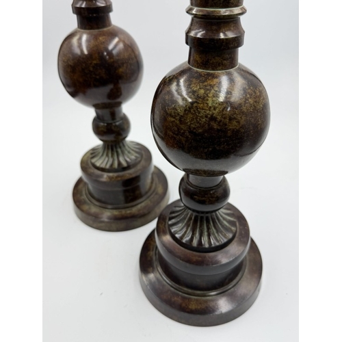 107 - A pair of obelisks finials H53cm