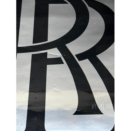 110 - A Rolls Royce sticker sign.