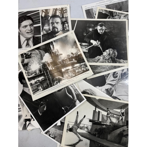 116 - A quantity of black and white stills, from a variety of James Bond films