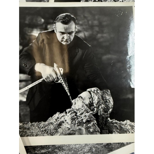 116 - A quantity of black and white stills, from a variety of James Bond films