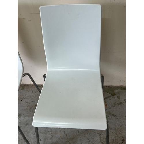 135 - A pair of white Italian chairs with chrome frames by Galvano Techica