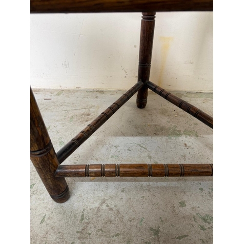 138 - A carved Swedish tripod monks chair